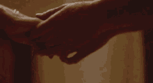 a close up of a woman 's arm with a bracelet on .