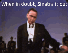 a man in a suit singing into a microphone with the words when in doubt sinatra it out