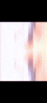 a blurry picture of a person with their arms outstretched against a pink background
