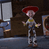 jessie from toy story is standing next to a box that says sheriff