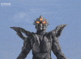 a statue of a monster with the word ultraman on it