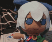 a stuffed doll with white hair and blue eyes has the word hi deo written on it