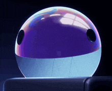 a purple ball with a white mouth and teeth is sitting on a table