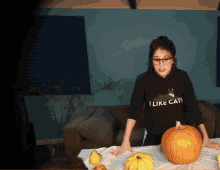 a woman wearing a sweatshirt that says i like cats