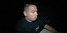 a blurred image of a person giving a thumbs up sign