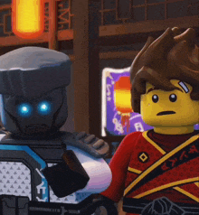two lego characters are standing next to each other in front of a sign that says ' ninjago ' on it