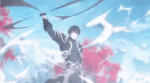 a man is holding a sword in his hand in front of a tree .