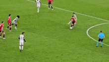 a group of soccer players are playing a game of soccer on a soccer field .