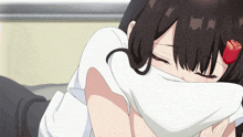 a girl with a rose in her hair is covering her face with a white cloth