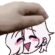 a hand is holding a donut on top of a girl 's head .