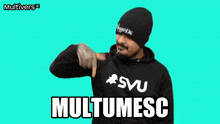 a man wearing a black hoodie that says multimesc on it