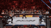 a wrestling ring with the word aew on the floor