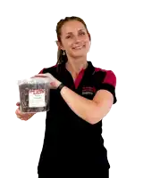 a woman is holding a plastic container with a label that says ' strawberry '