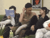a group of people sit on a couch reading a book called you deserve better