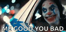 the joker from the movie joker is smiling while driving a car and says `` me good you bad '' .