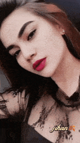 a close up of a woman 's face with the name juhan on the bottom right