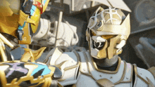 a knight with a crown on his head stands next to another knight in armor
