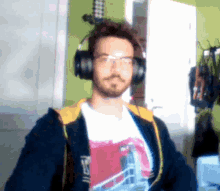 a man wearing headphones and a t-shirt that says ' nc ' on it