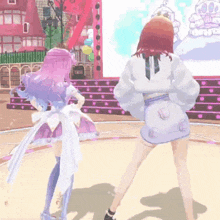 two anime girls are dancing on a stage in front of a crowd