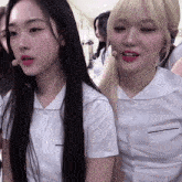 a group of girls are posing for a picture and one of them has a microphone in her mouth