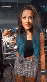 a woman with blue hair is holding a trophy in front of a screen that says " codeoflyra "