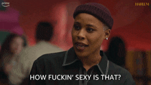 a woman says how fuckin ' sexy is that while wearing a beanie