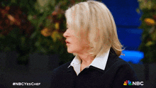 a woman 's face is shown in a nbc ad