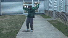 a person wearing a boba fett mask is standing on a sidewalk
