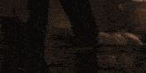 a man and a woman are dancing together in a dark room