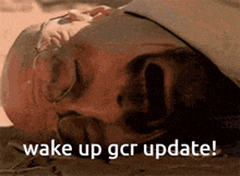 a man laying on the ground with the words wake up gcr update written below him