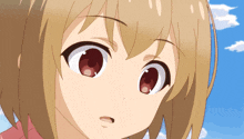 a close up of a girl 's face with brown hair and red eyes