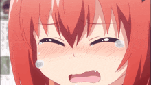 a close up of a girl with red hair crying