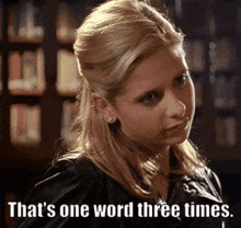 a woman says " that 's one word three times " in front of a library