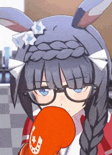 a close up of a girl wearing boxing gloves with a horseshoe on them