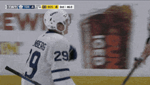 a hockey player wearing a number 29 jersey