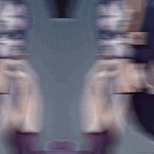 a blurry picture of a person 's face with purple lipstick