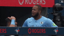 a blue jays player is talking to another player