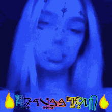 a woman with a tattoo on her forehead is surrounded by flames and the word " rasta "