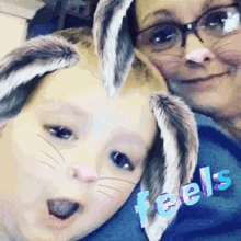 a woman and a child wearing bunny ears with the word feels on the bottom