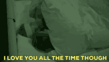 a couple is laying in bed under a blanket with the words i love you all the time though written on the bottom .