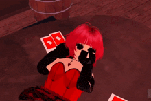 a girl with red hair and black gloves is laying on the floor