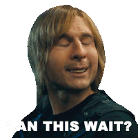 a man with blonde hair is smiling with the words " can this wait " behind him