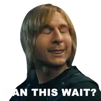 a man with blonde hair is smiling with the words " can this wait " behind him