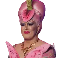 a drag queen wearing a pink flower wig and necklace