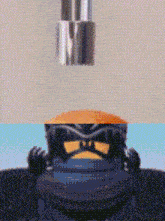 a close up of a lego figure with a screwdriver in its head