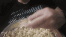 a person is putting popcorn into a bowl with a speech bubble that says ' i love you ' on it