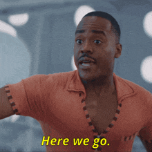 a man with a surprised look on his face says " here we go "