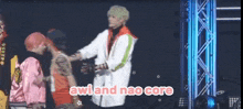 a group of people standing on a stage with the words awi and nao core written on the bottom
