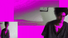a man in a black shirt is standing in front of a purple background