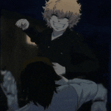 a blurry picture of a man holding another man in his arms .